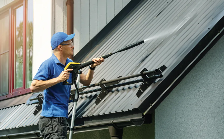 A roof being high-pressure cleaned